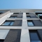 Фотографии многоэтажного дома с клинкерной фасадной плиткой Stroeher Keravette 330 graphit